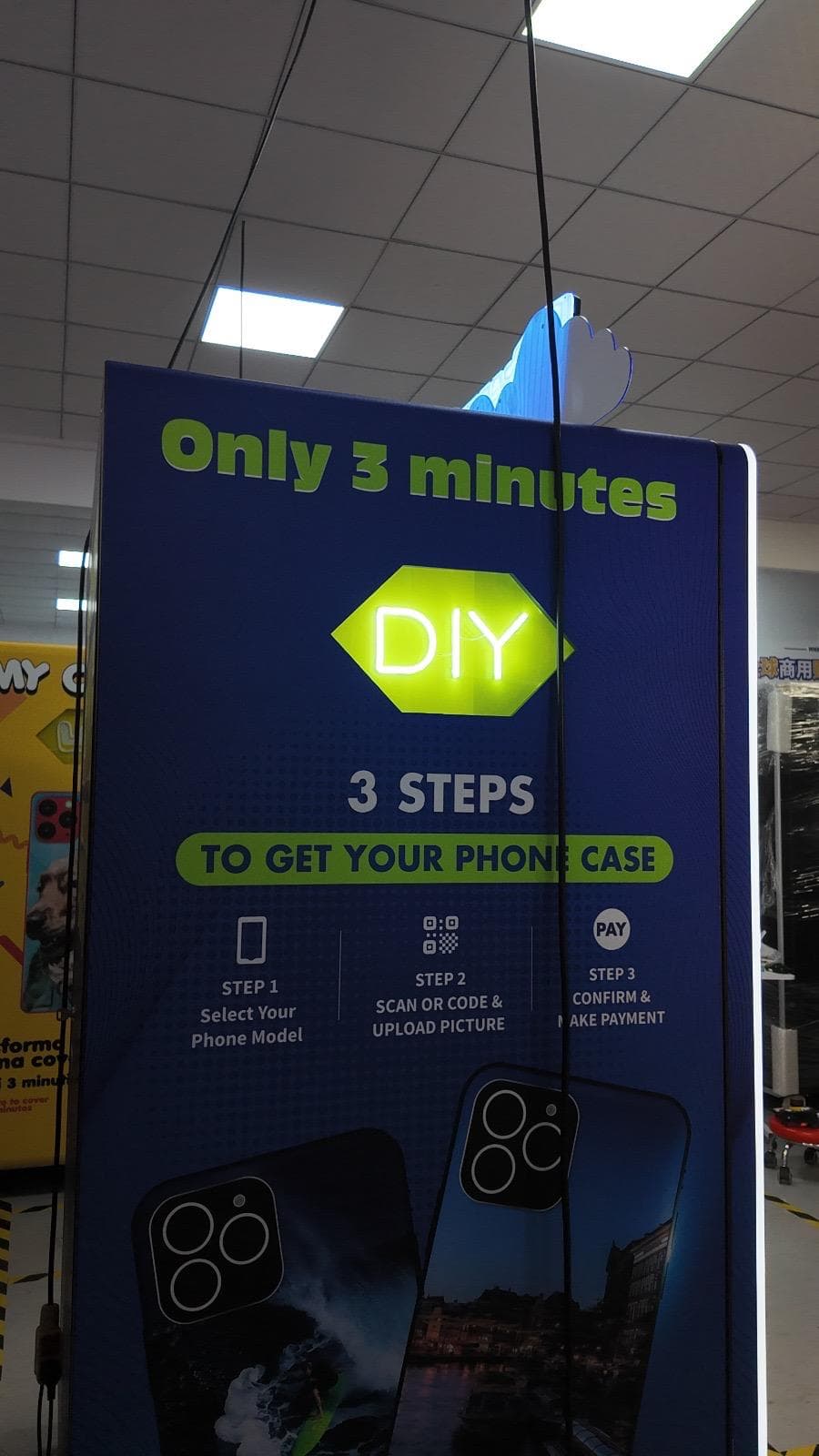 Side of the Captured Cases kiosk showing the three-step ordering instructions